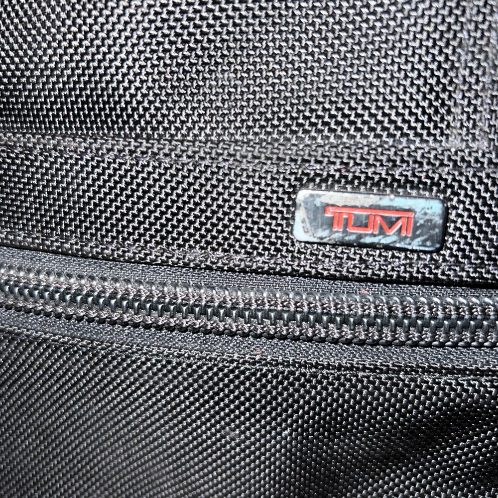 Tumi alpha luggage expandable 2 wheeled. 25”, garment holder, tag, and hook.